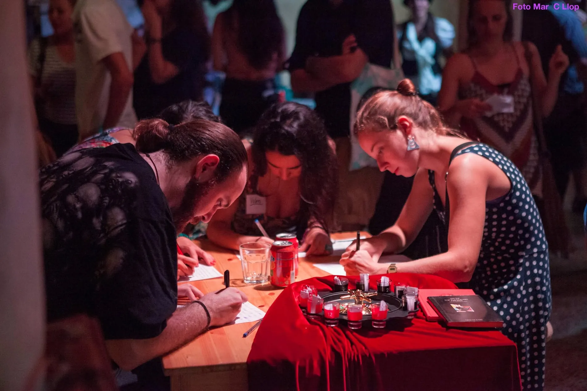Participants writing at the Literary Casino